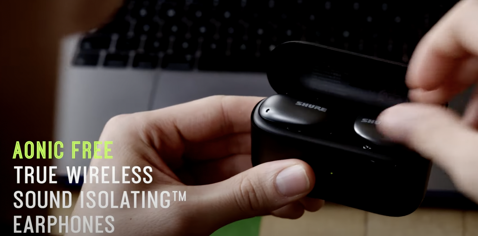 Shure AONIC FREE true wireless earphones held in their charging case during the campaign shoot